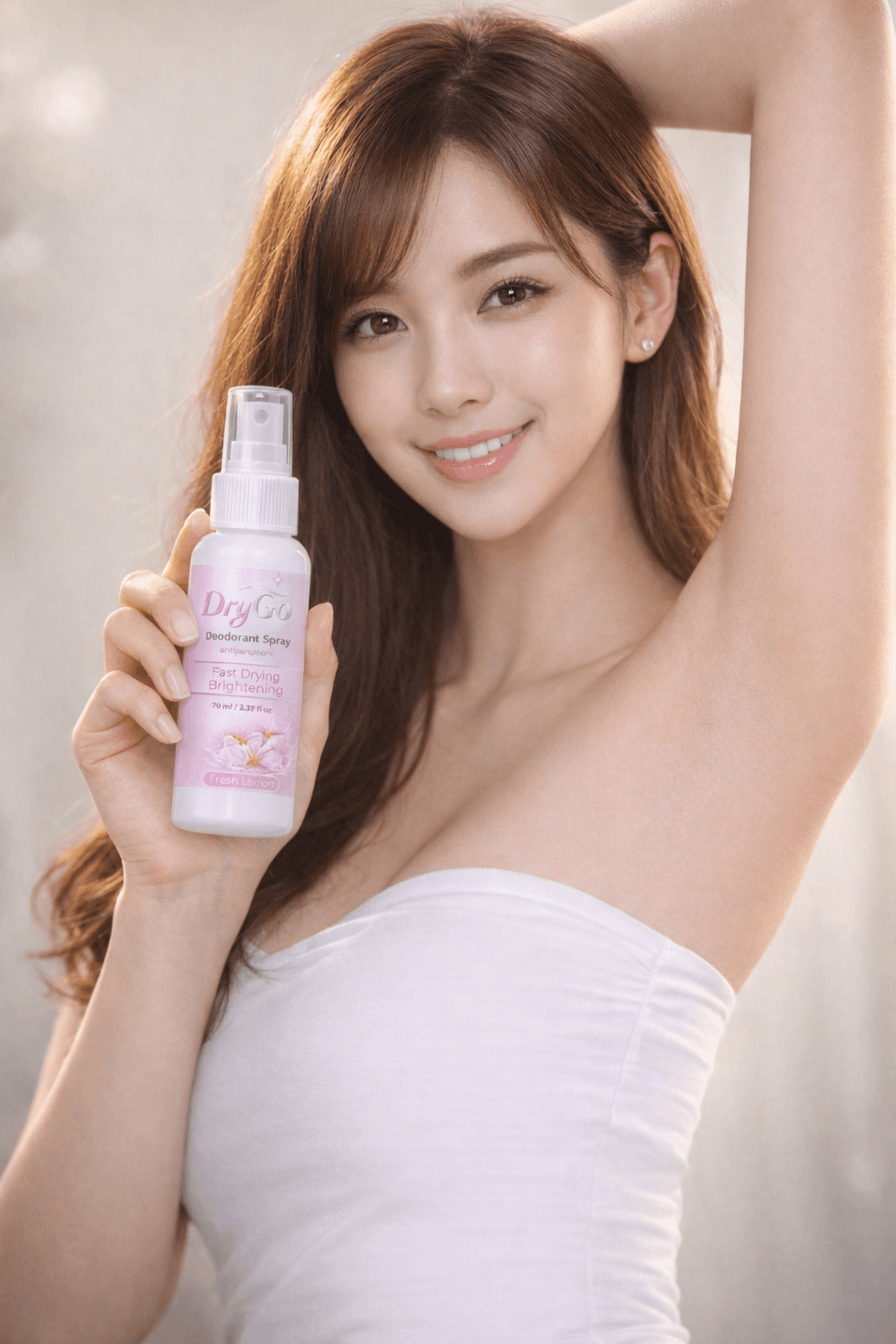 Smiling woman holding DryGo deodorant spray, showcasing her smooth underarm with one arm raised.